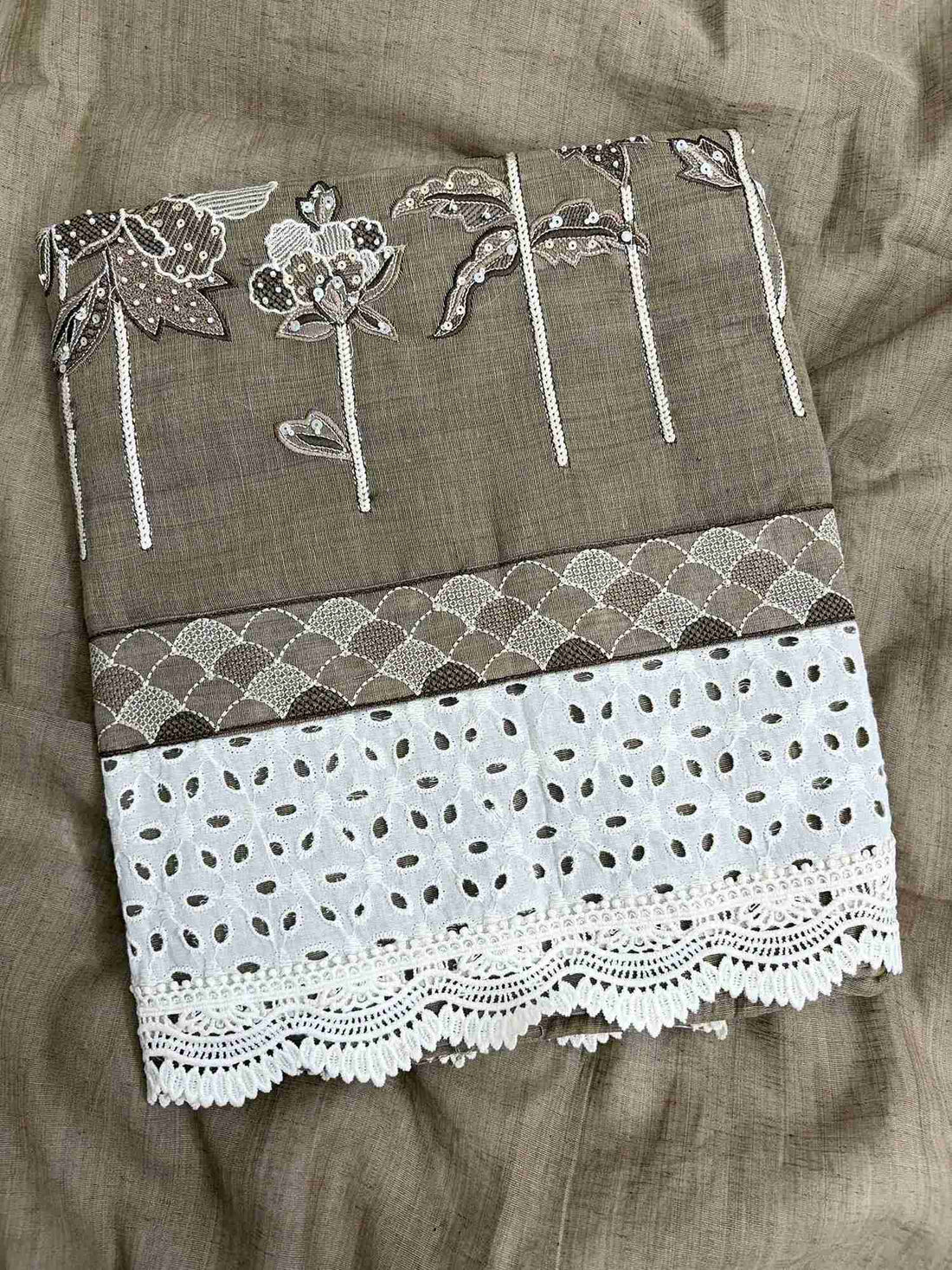 Broad schiffili cotton hem border with crotia lace at the bottom of khakhi mul chanderi shirt