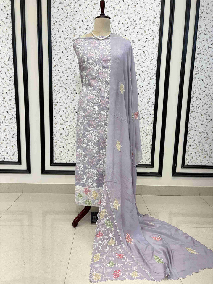 Contrasting cotton bottom detail with abstract streak print paired with lavendar cotton suit
