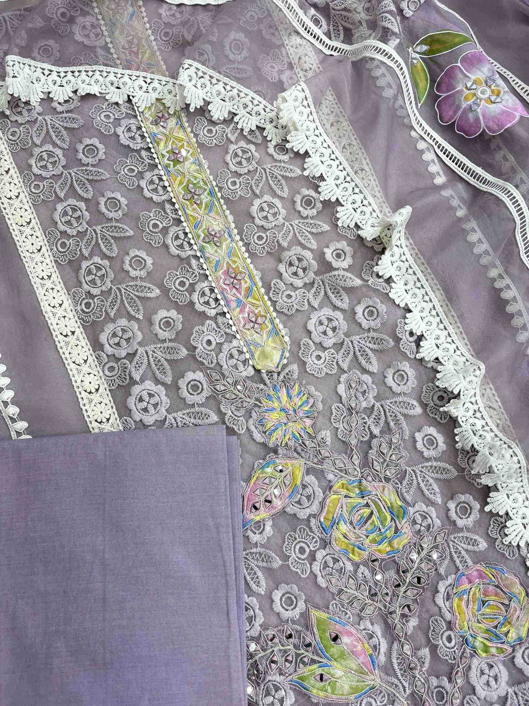 Complete lavendar organza unstitched suit flat lay set with lace panel shirt, dupatta, and matching bottom