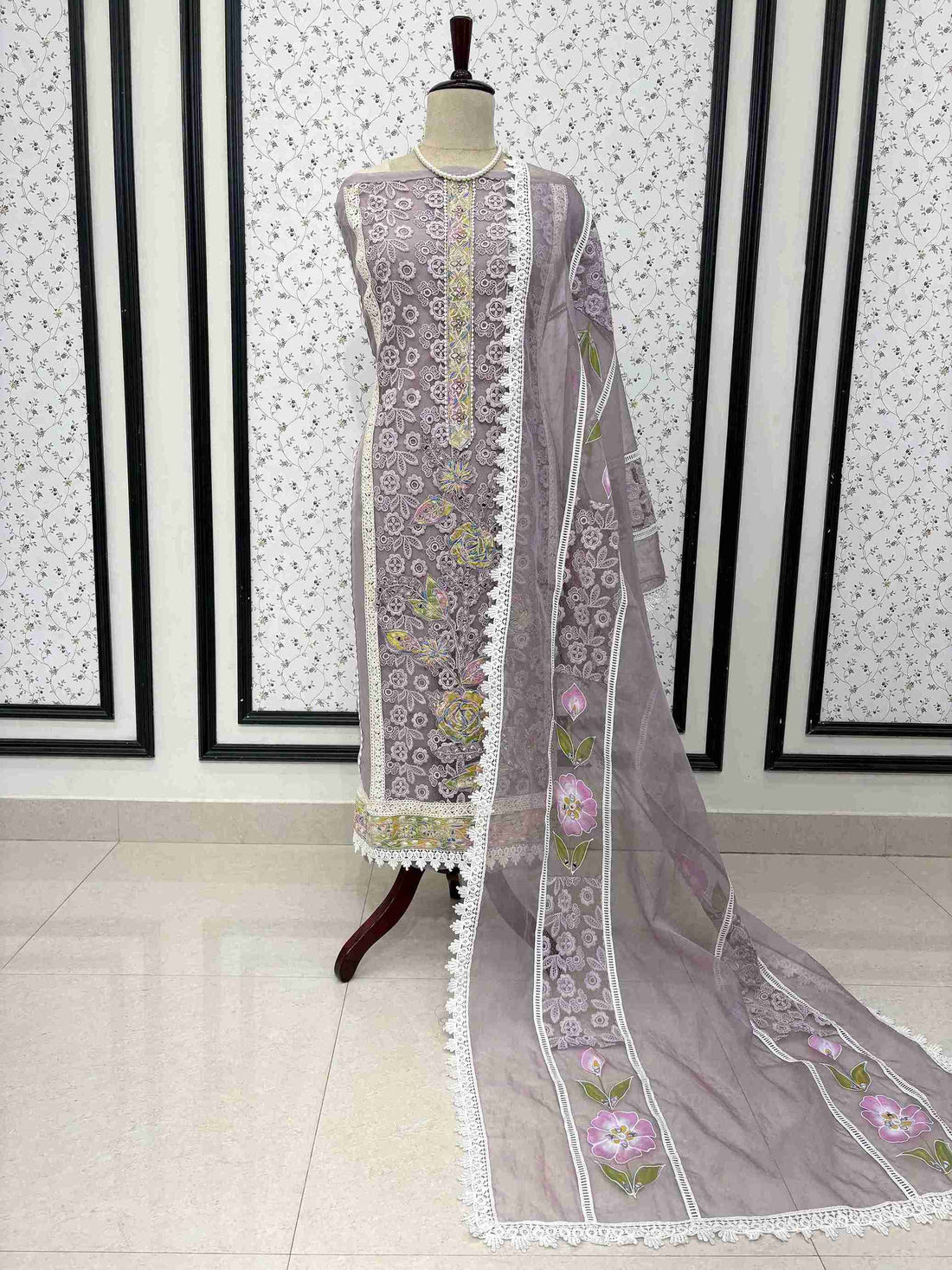 Lavendar organza unstitched suit full front view with hand-painted floral dupatta draped on mannequin