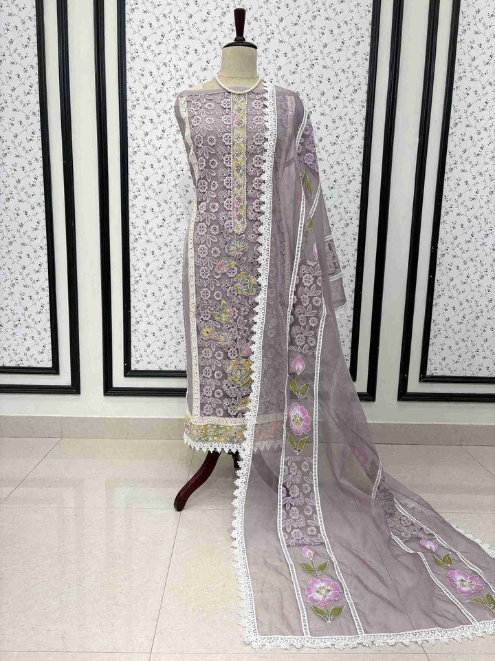 Lavendar organza unstitched suit full front view with hand-painted floral dupatta draped on mannequin