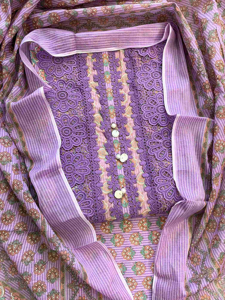 Close-up of all-over geometric floral print with stripe texture in teal, peach, and olive tones on lavender cotton shirt body