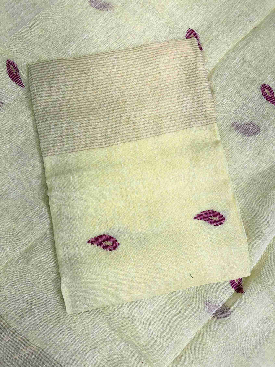 Scattered small pink paisley woven motifs across lemon yellow linen shirt body