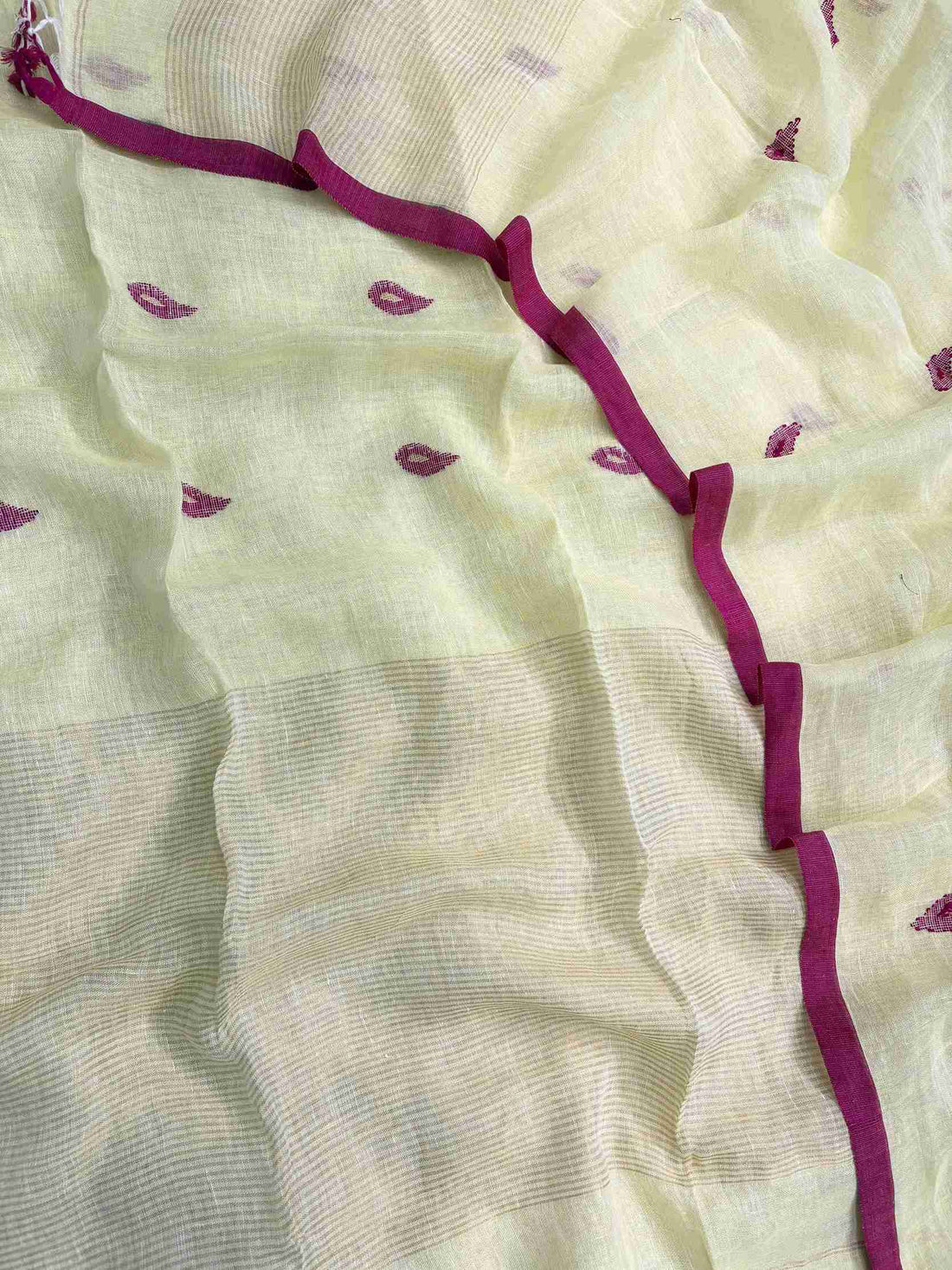 Thin golden stripe band at daaman hemline of lemon yellow linen unstitched shirt