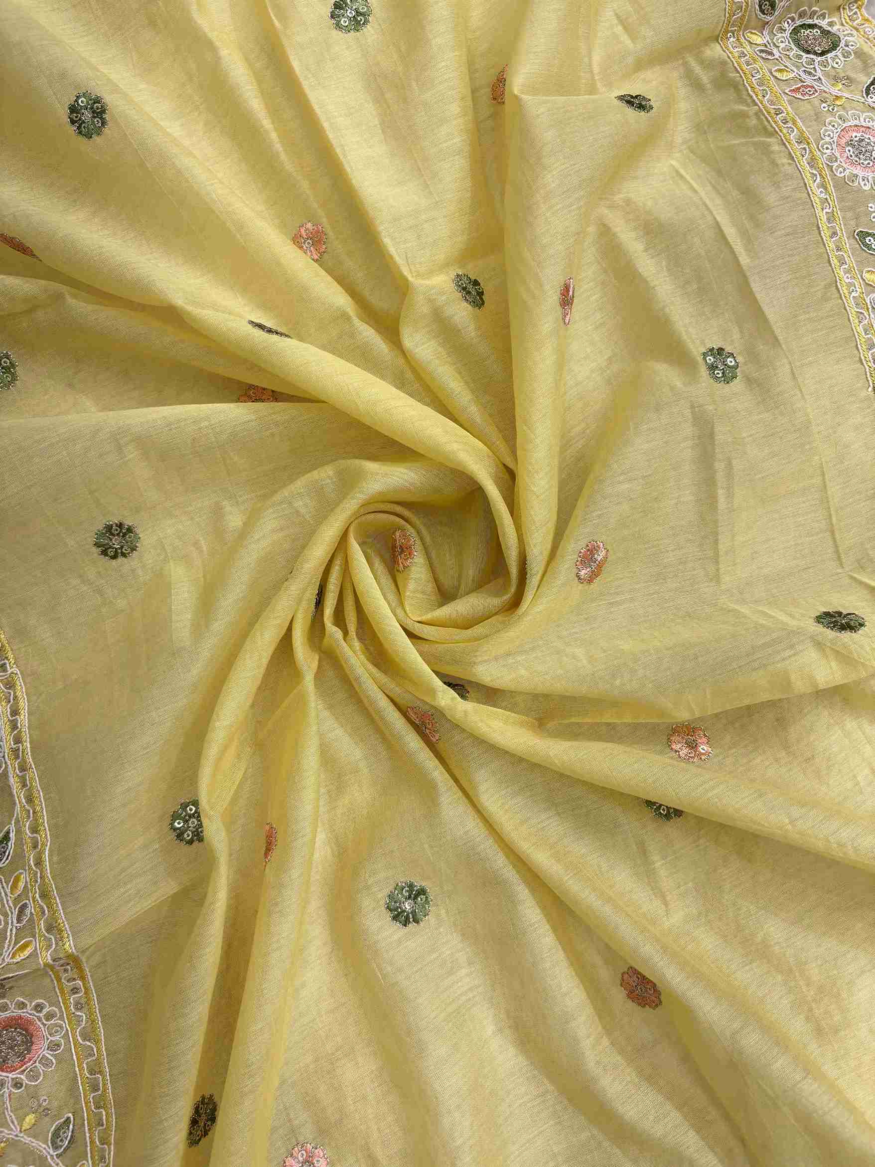 Scattered multicolor thread embroidered floral booties with mirror accents across lemon yellow mul chanderi dupatta