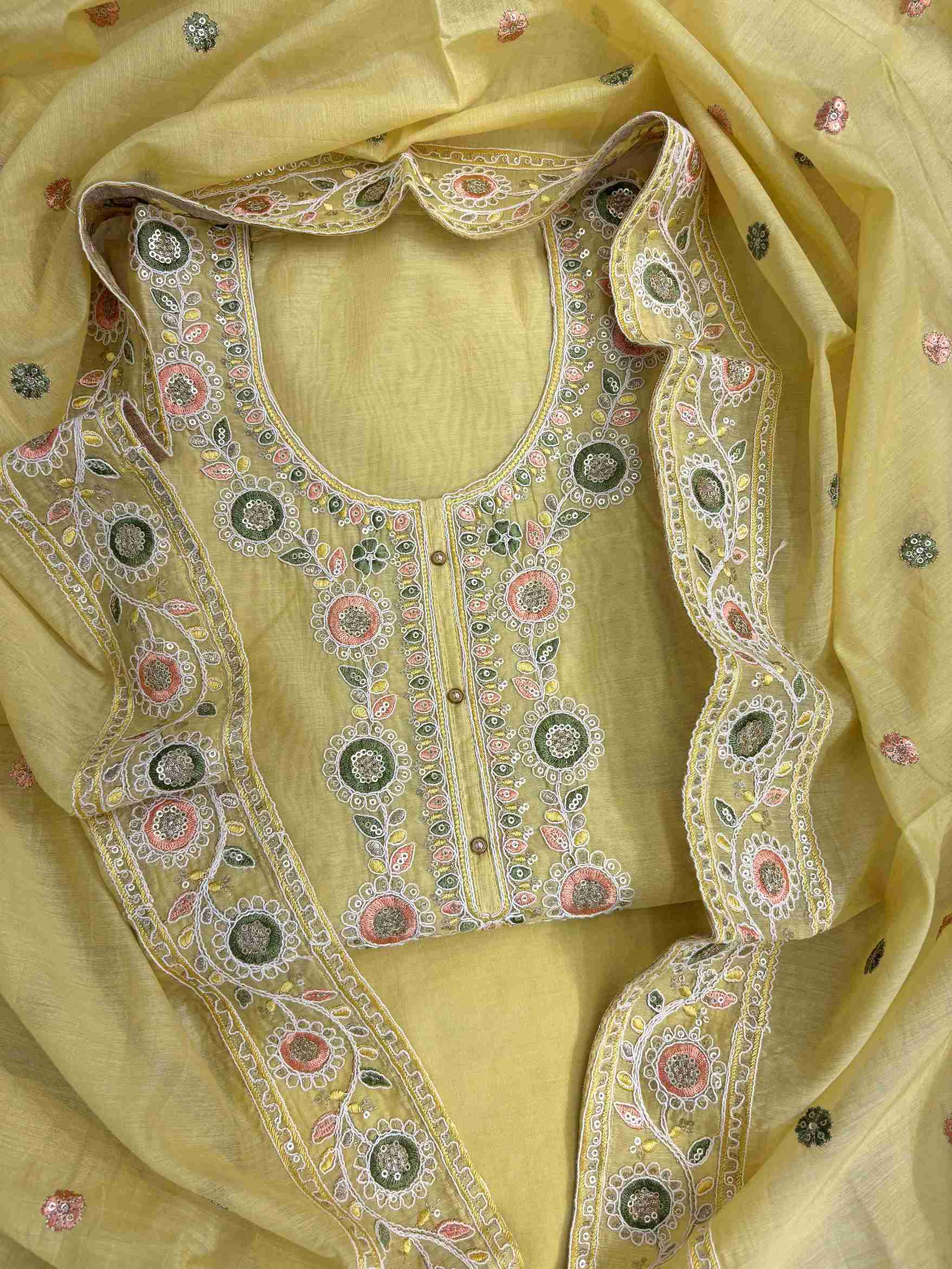 Scalloped crotia lace border finishing at hemline of lemon yellow mul chanderi unstitched shirt