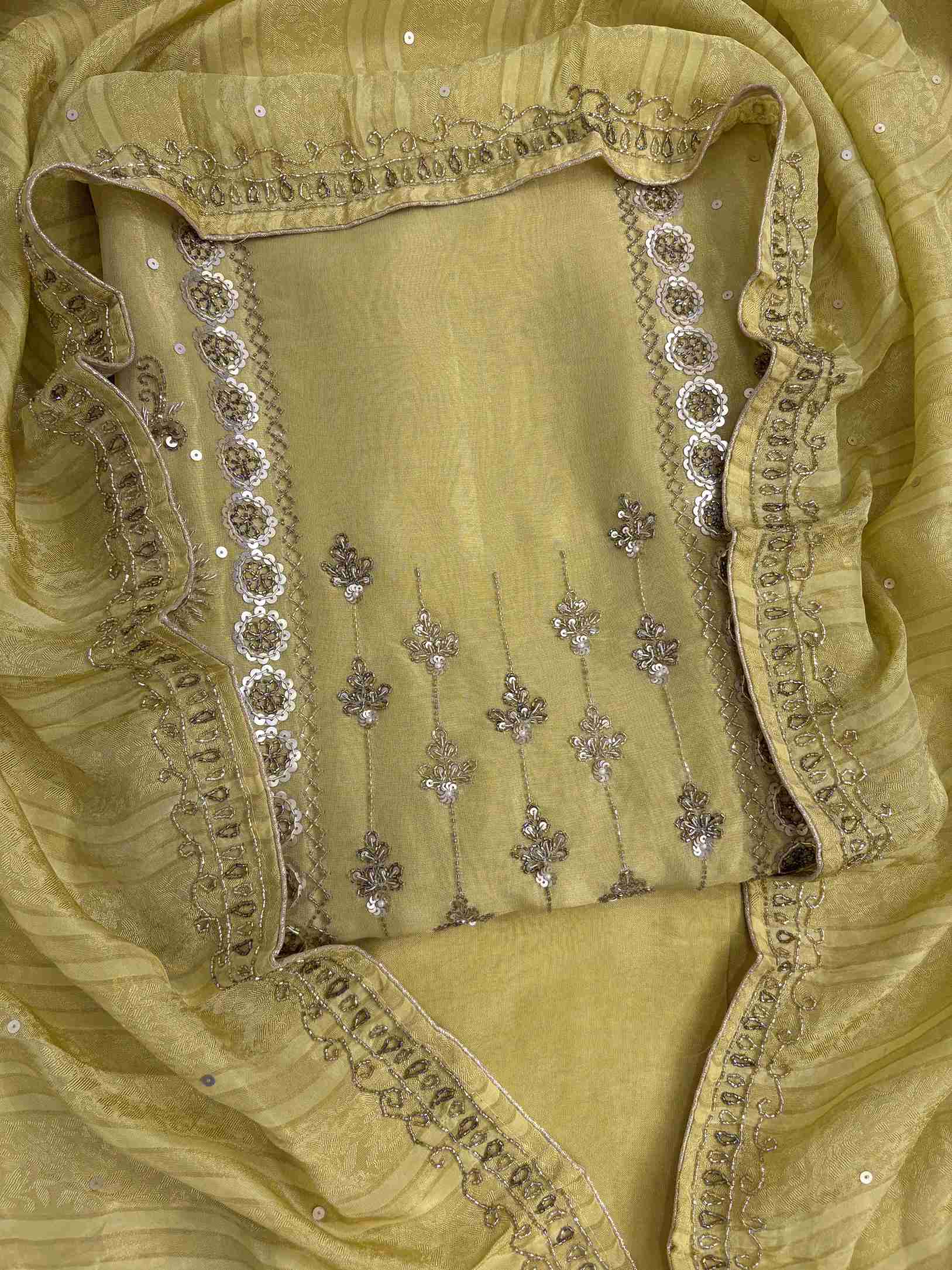 Front view of lemon yellow shimmer organza heavy handwork unstitched suit set