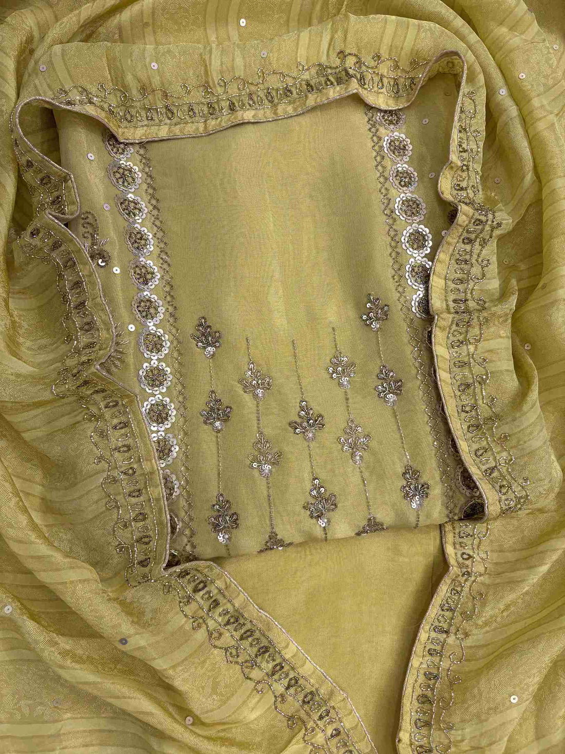 Front view of lemon yellow shimmer organza heavy handwork unstitched suit set