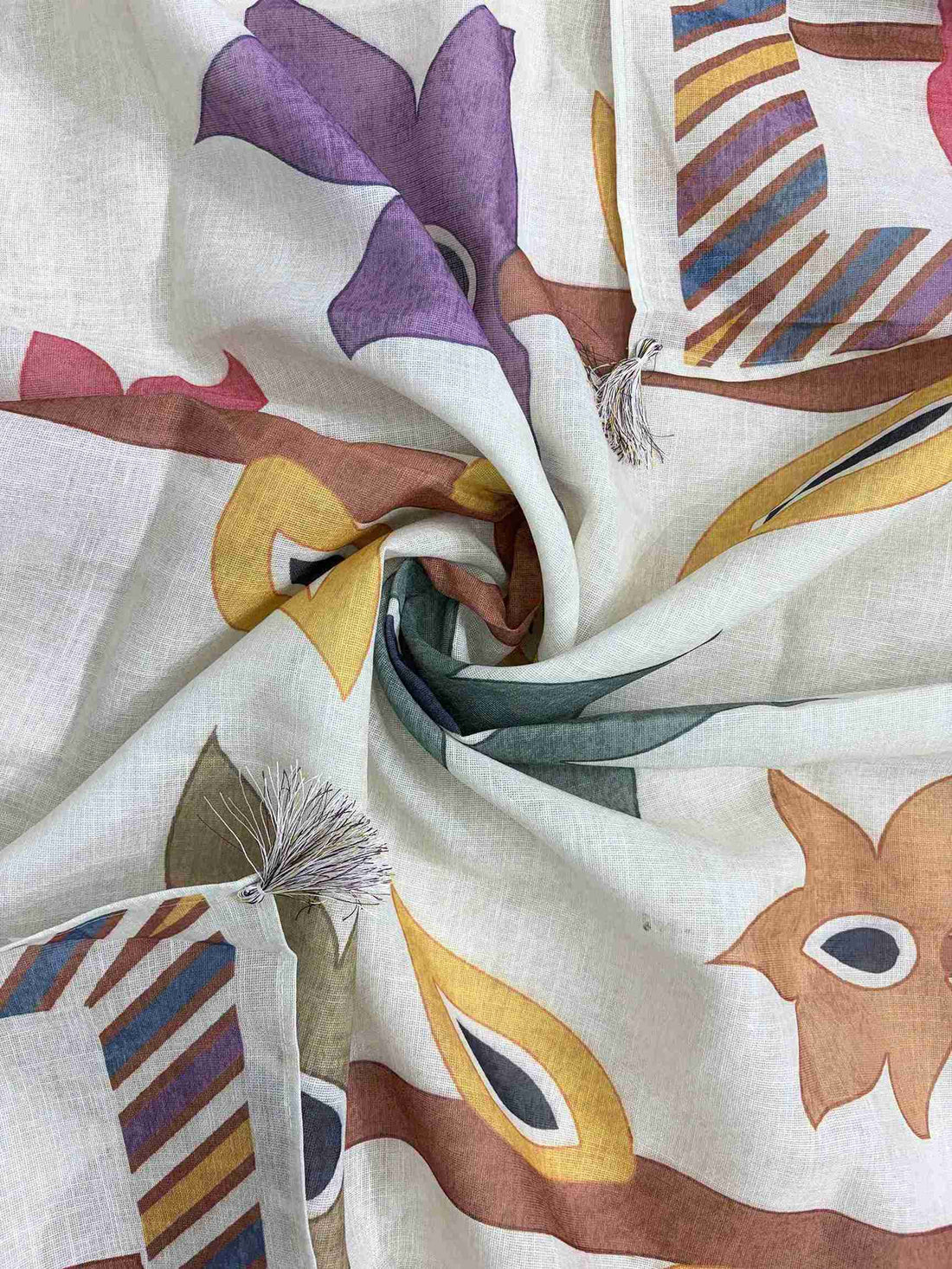 Large-scale multicolor geometric botanical leaf print in red, purple, olive, and mustard tones on light pista linen dupatta