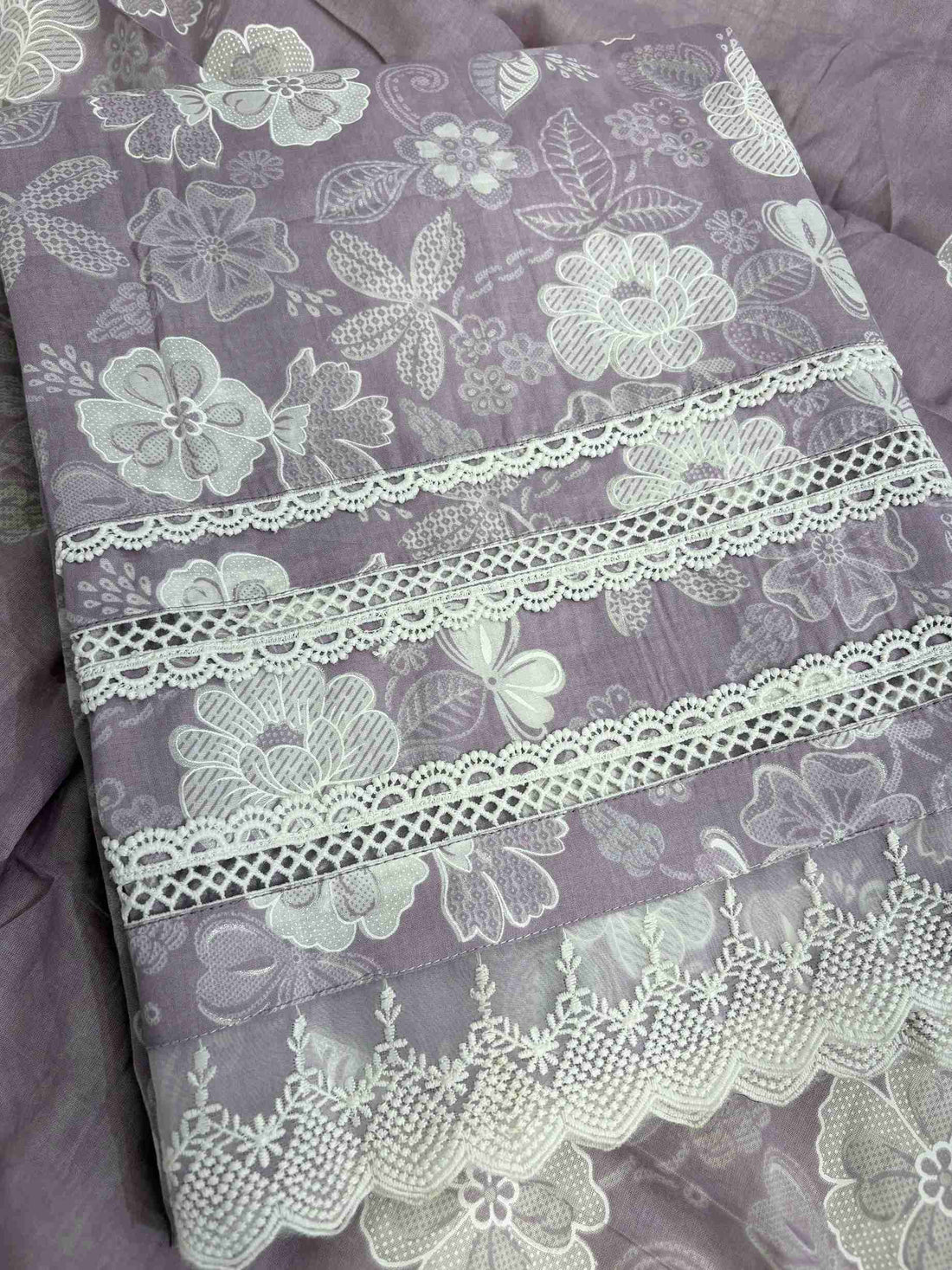 Multiple row crotia lace hemline finishing detail at the bottom of lilac cotton shirt