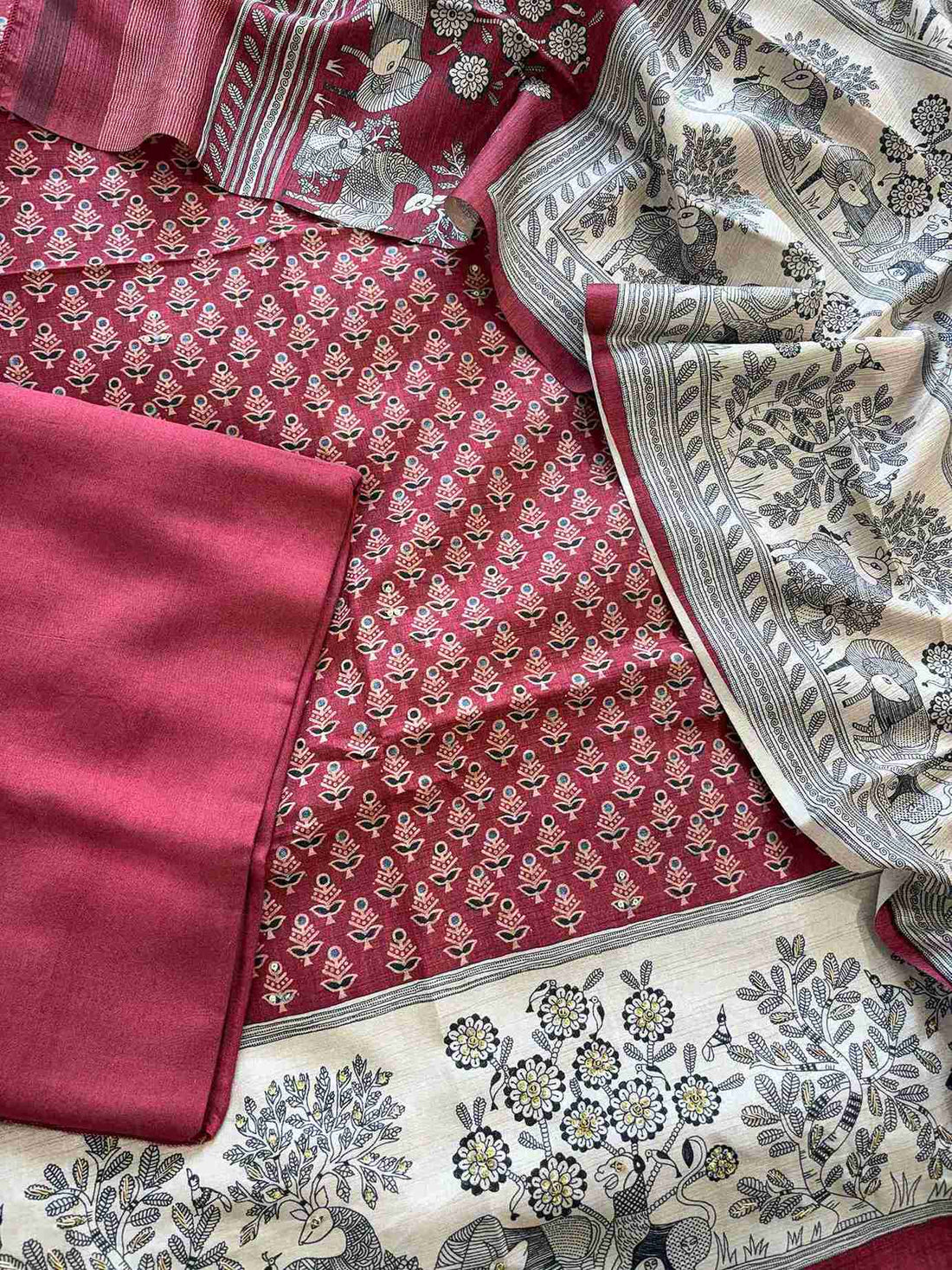 Cream hemline border with printed animal-tree scene on maroon chanderi silk suit