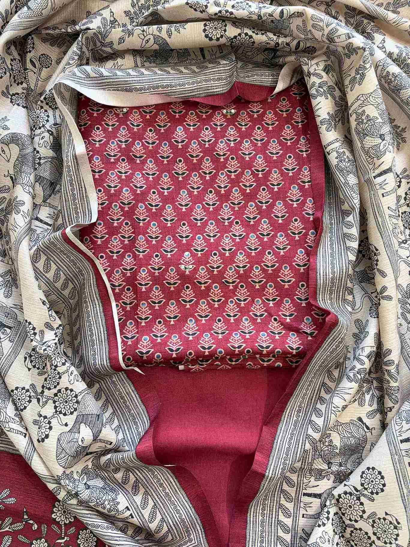 Close-up of printed small motifs with sequin embellishment on maroon chanderi silk suit shirt