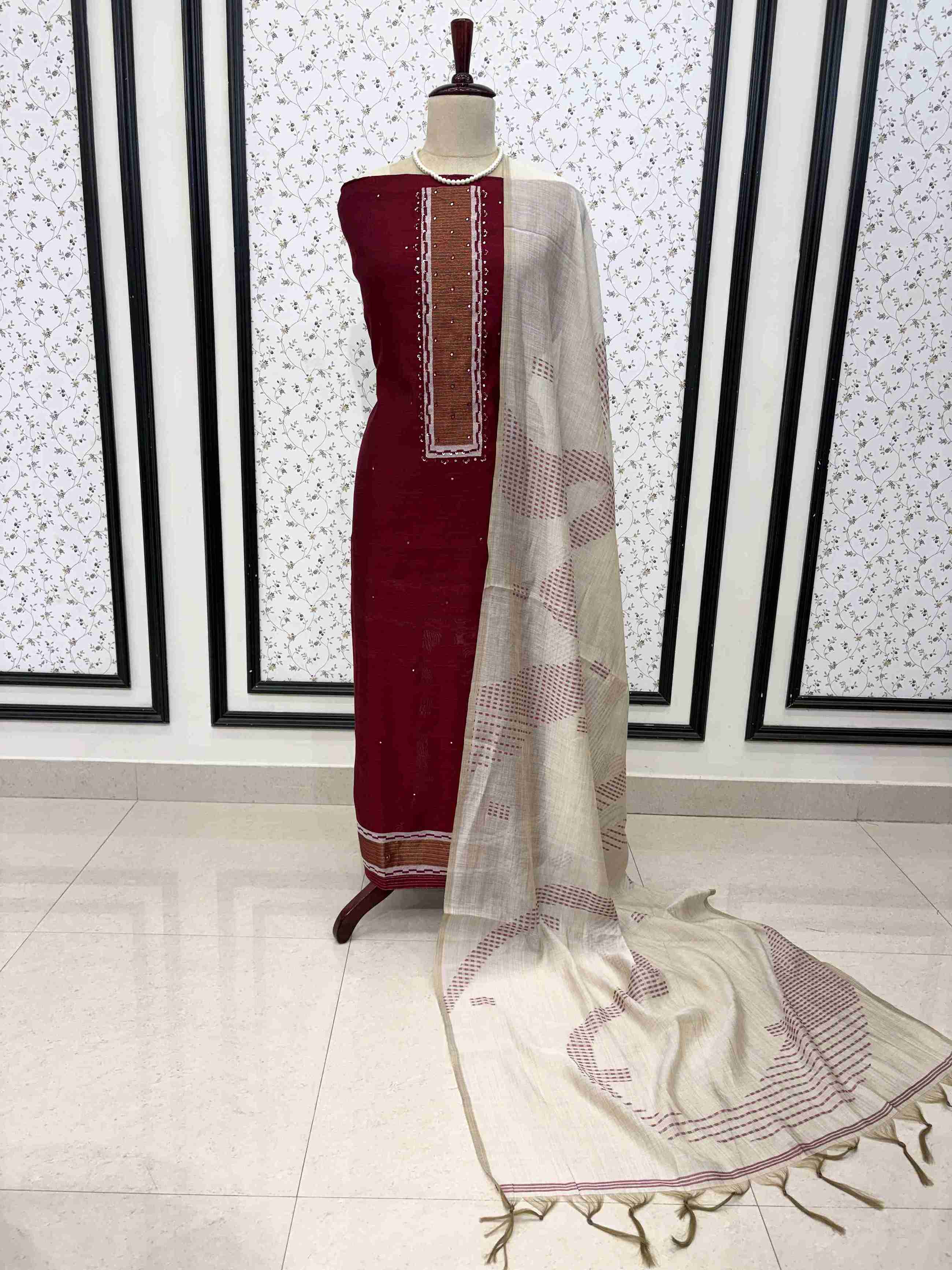 Maroon viscose unstitched suit set displayed on mannequin with mirror highlight neckline and dupatta