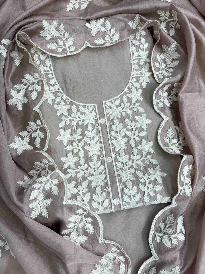 Scattered crotia floral motifs across mauve jaam cotton shirt body with crotia lace hemline border