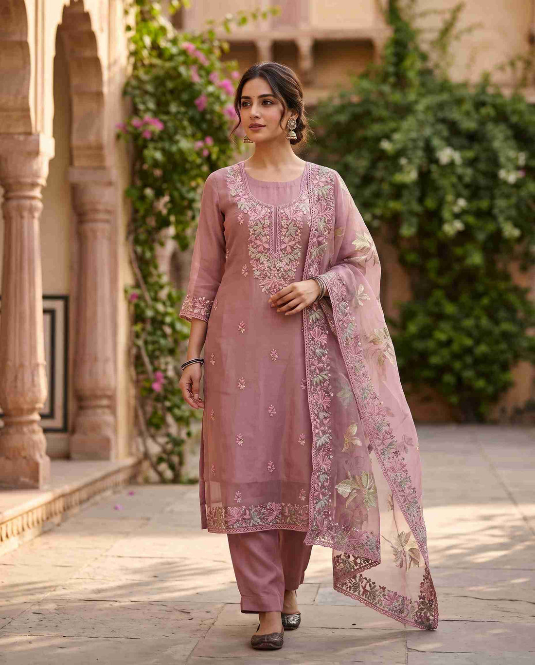 Floral thread embroidery along the hemline of mauve pink glass organza suit