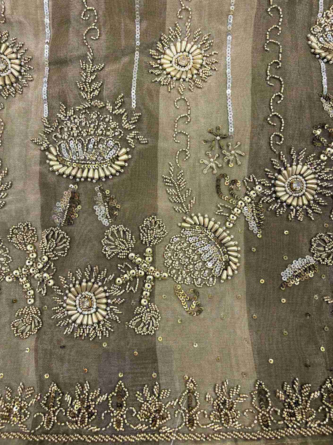 Metallic bronze shimmer tissue fabric featuring metallic bugle beads sequins and crystals