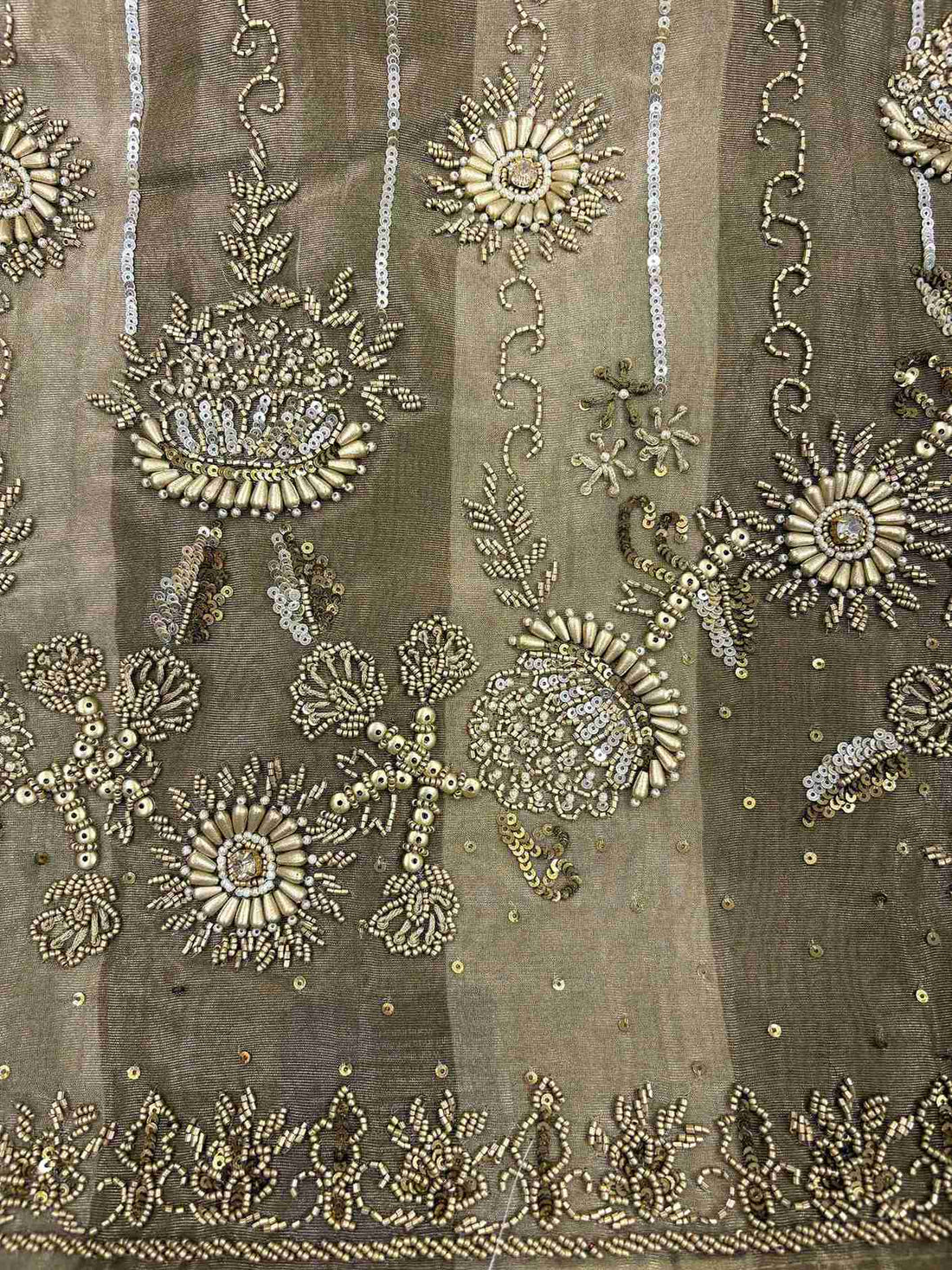 Metallic bronze shimmer tissue fabric featuring metallic bugle beads sequins and crystals
