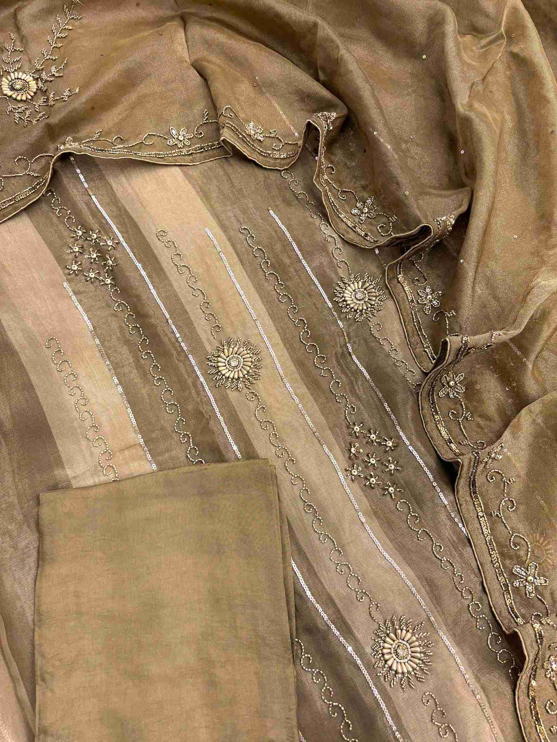 Metallic bronze heavy unstitched suit set with shimmer tissue shirt dupatta and opada silk bottom