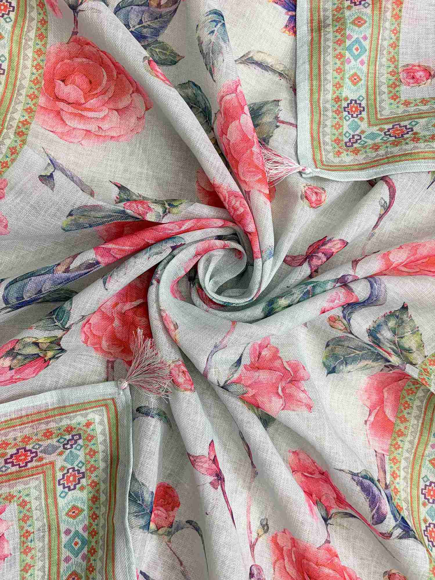 Printed geometric and floral border with multicolor tassels at end of mint blue linen dupatta