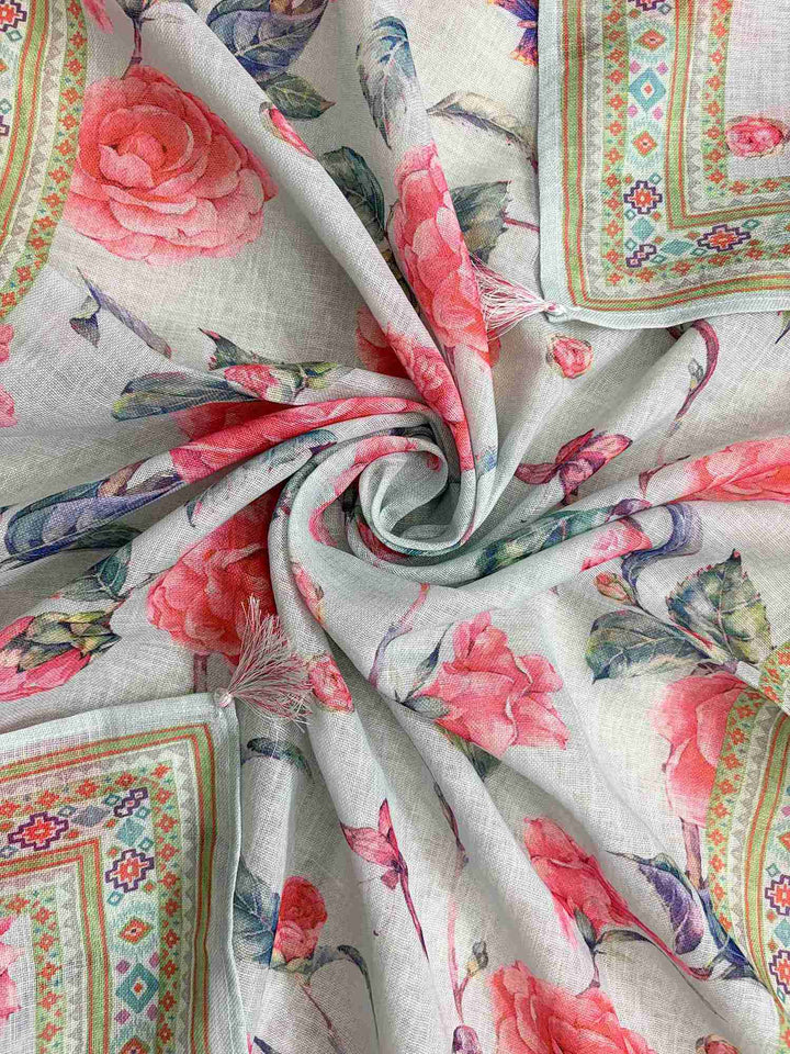 Printed geometric and floral border with multicolor tassels at end of mint blue linen dupatta