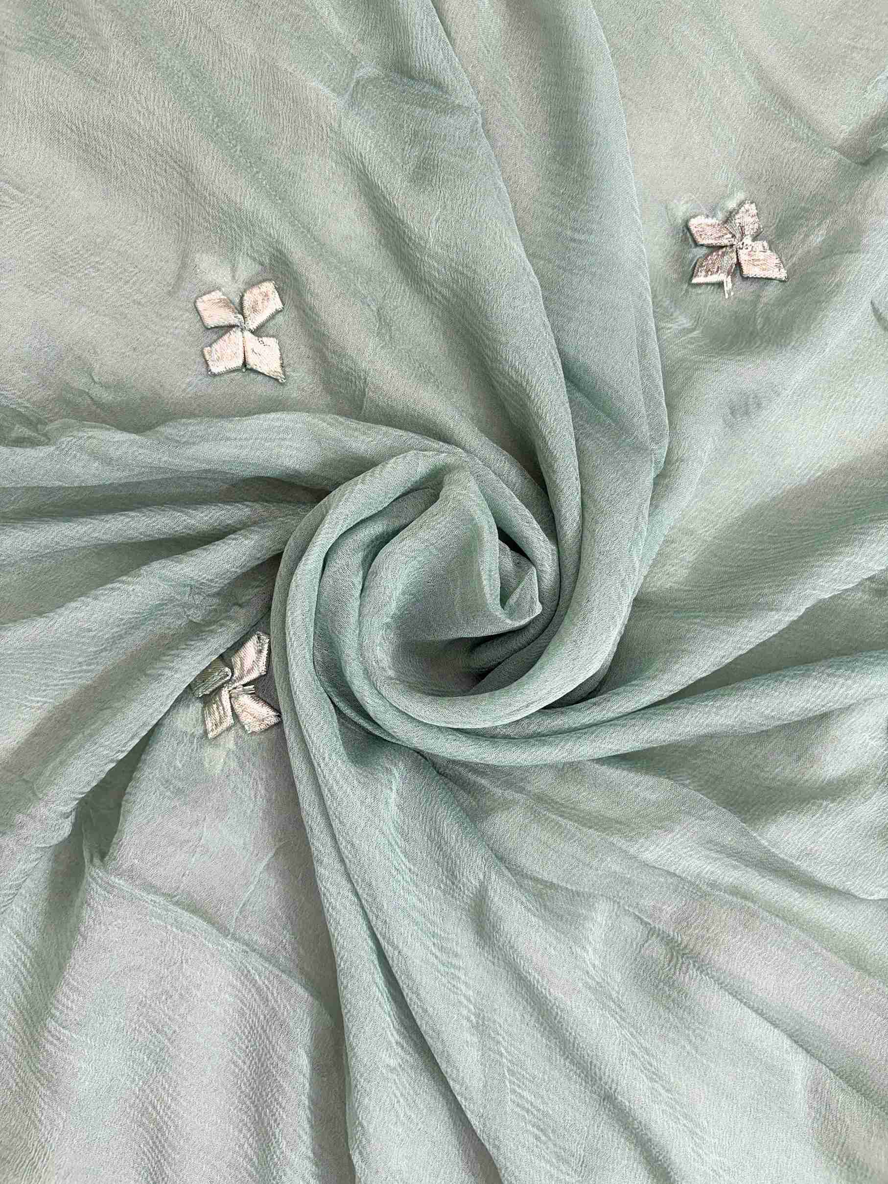 Bota lace border and scattered gota floral motifs across mint green chiffon dupatta surface