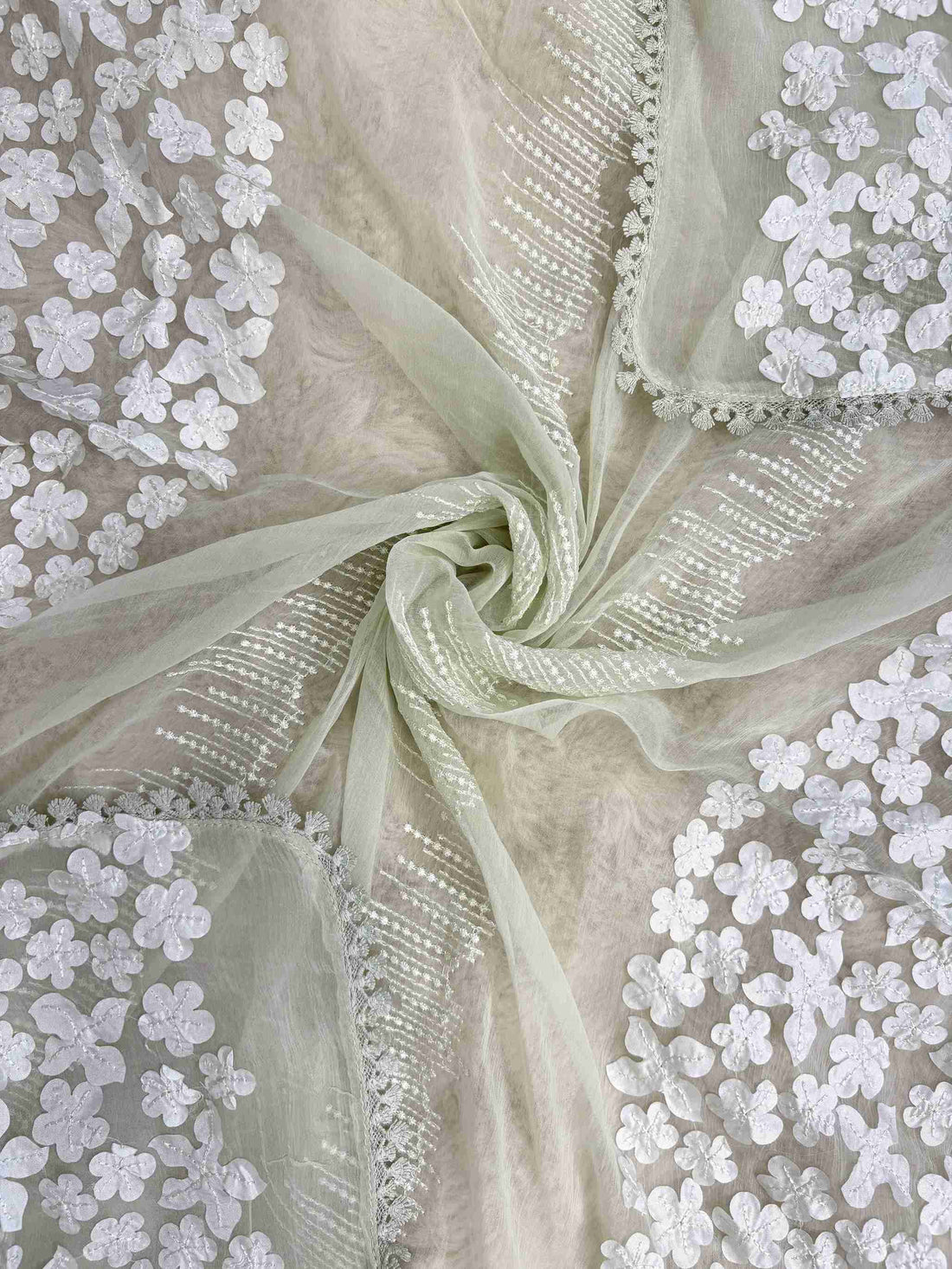 White floral applique on longer sides and four-sided lace finishing on mint green chiffon dupatta