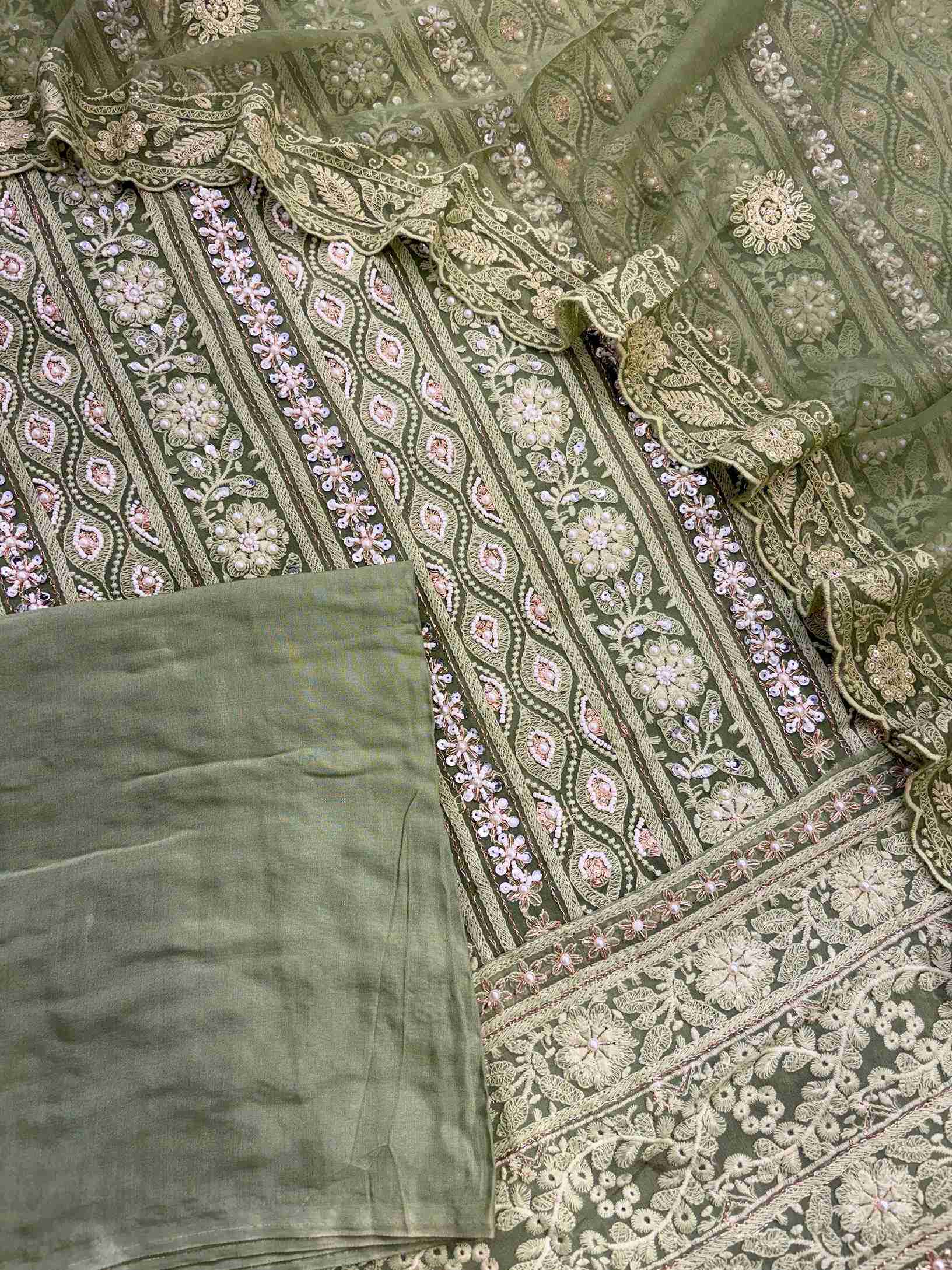 Close-up of heavy chikankari embroidery with mirror and sequin work on georgette