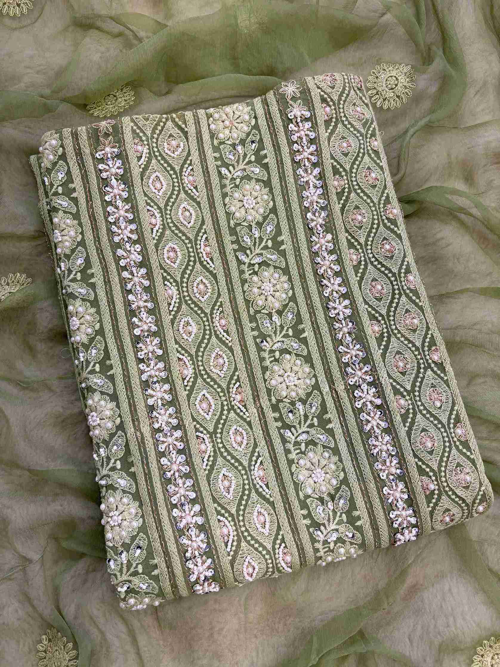 Mint green unstitched chikankari suit with chiffon dupatta full length view