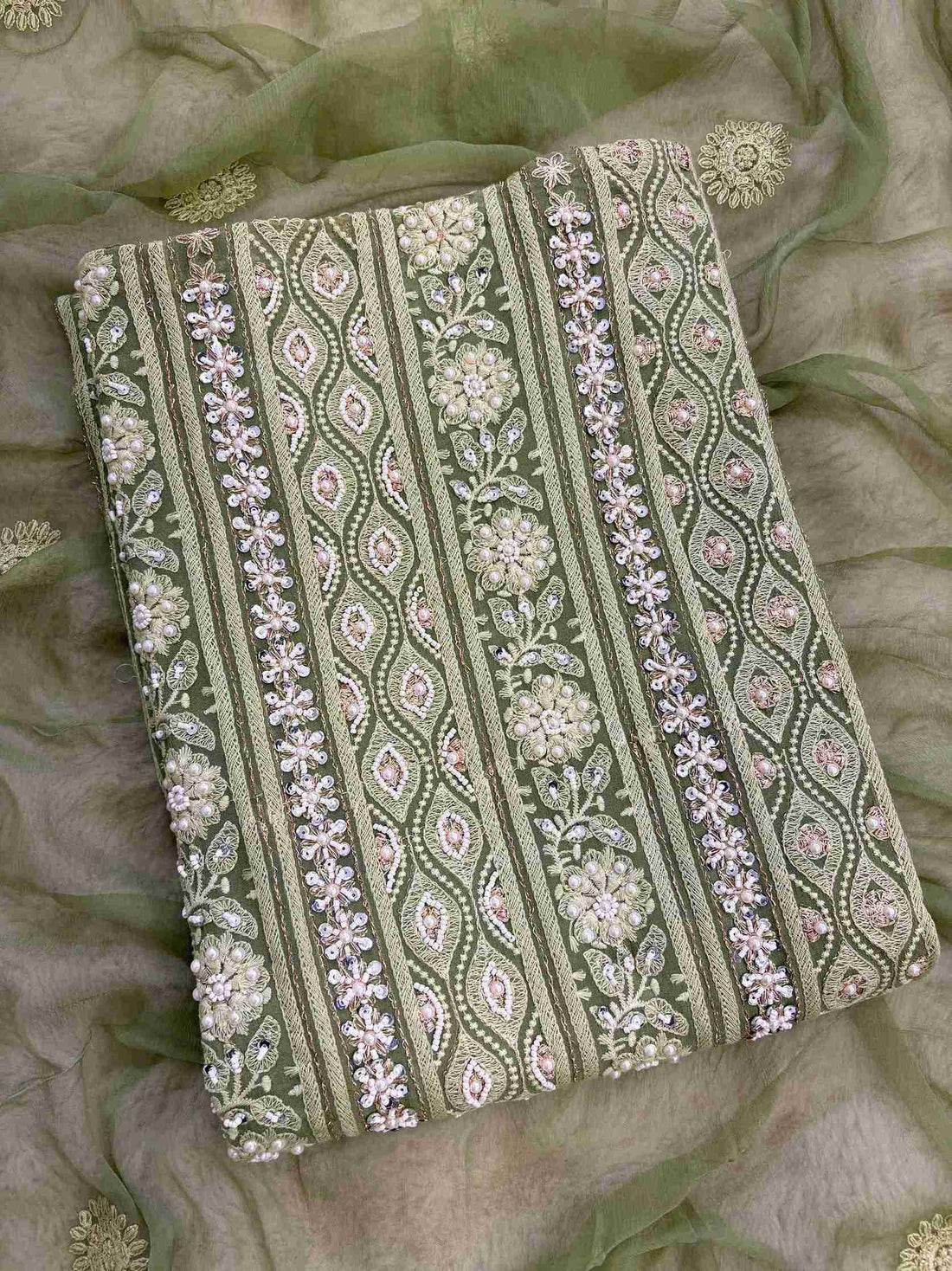 Mint green unstitched chikankari suit with chiffon dupatta full length view