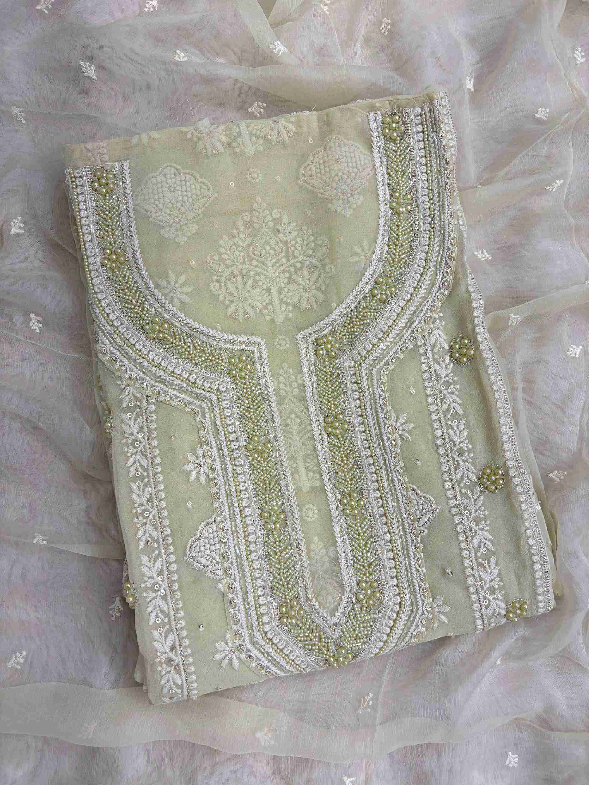 Mint green georgette chikankari suit with moti and bead embellished neckline