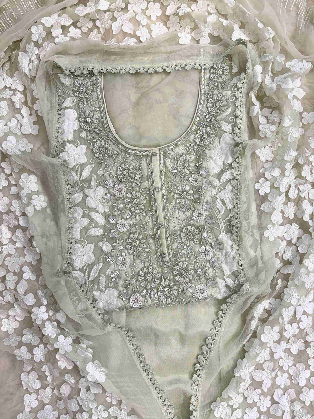 Heavily embellished sequin, moti, and bead neckline detail on mint green organza unstitched shirt