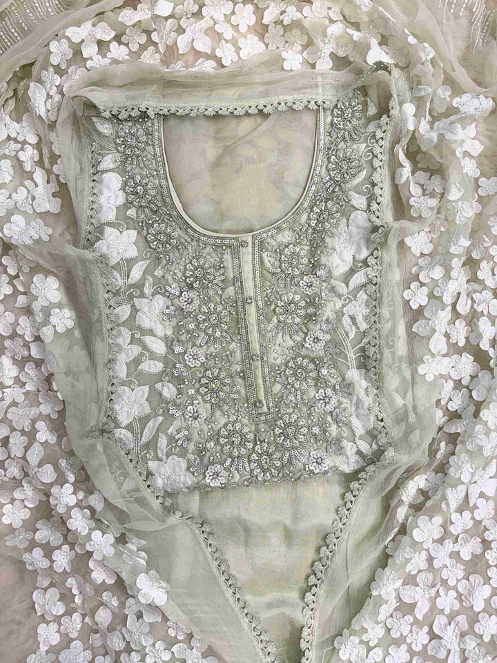 Heavily embellished sequin, moti, and bead neckline detail on mint green organza unstitched shirt