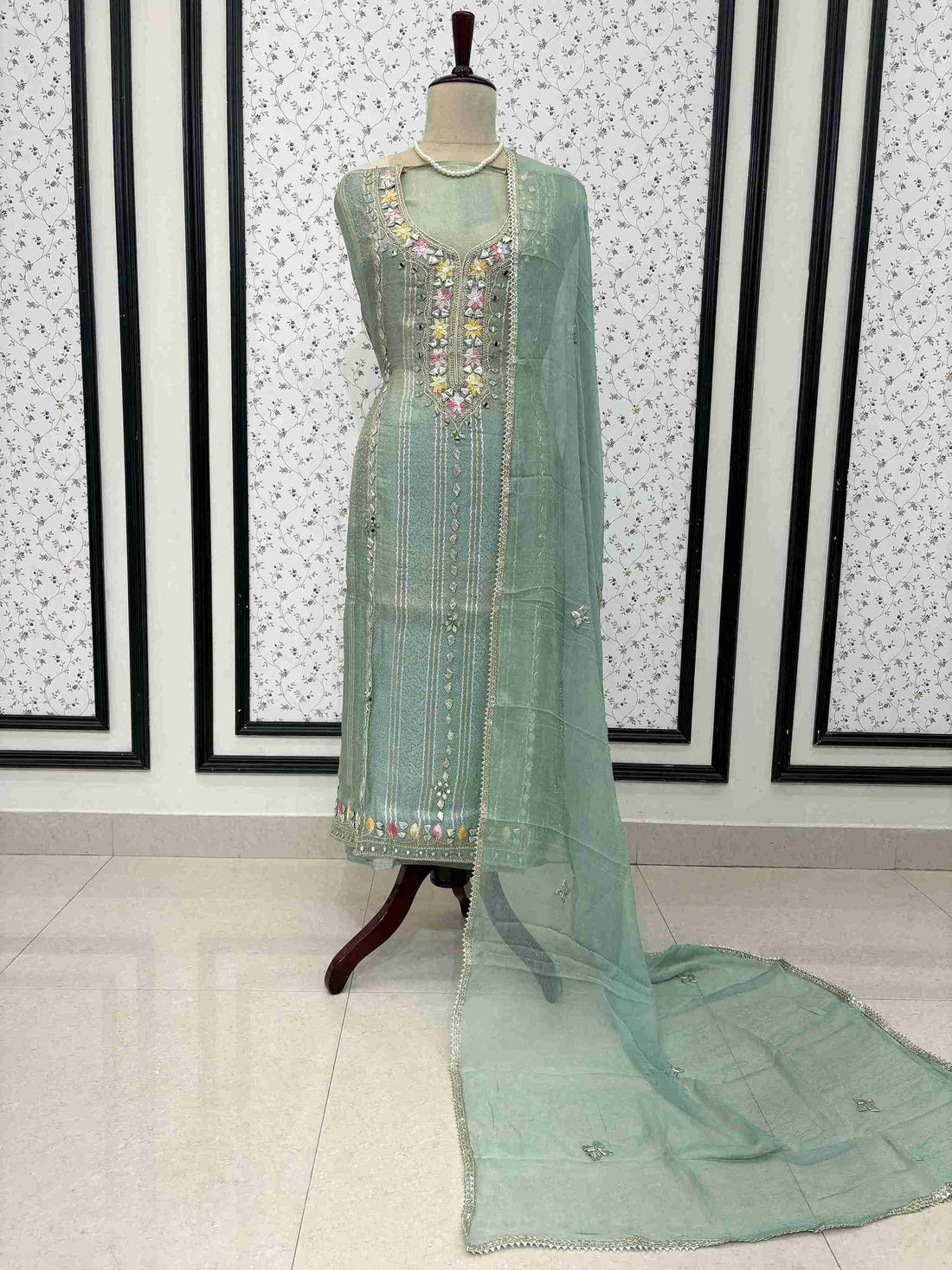 Mint green shimmer tissue unstitched suit full front view with gota lace bordered chiffon dupatta draped on mannequin