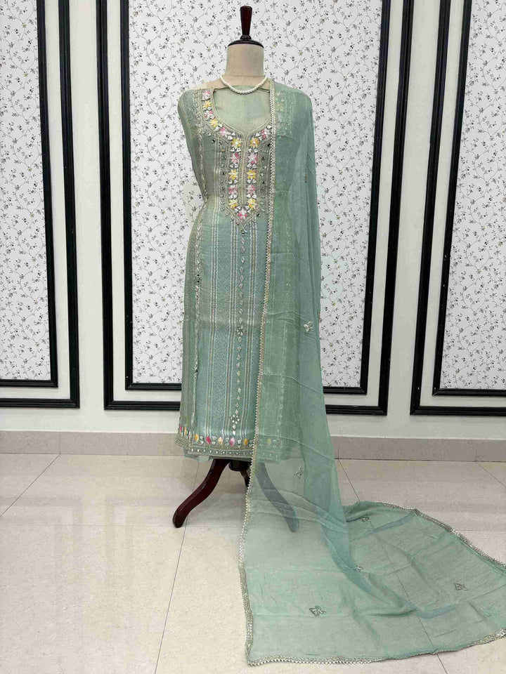 Mint green shimmer tissue unstitched suit full front view with gota lace bordered chiffon dupatta draped on mannequin