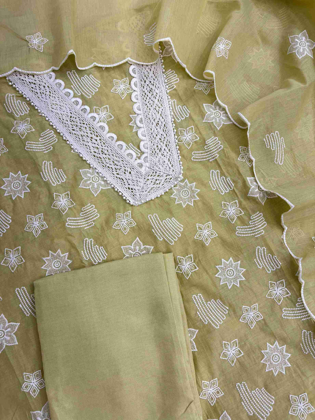 Lace border detailing on mint green embroidered suit