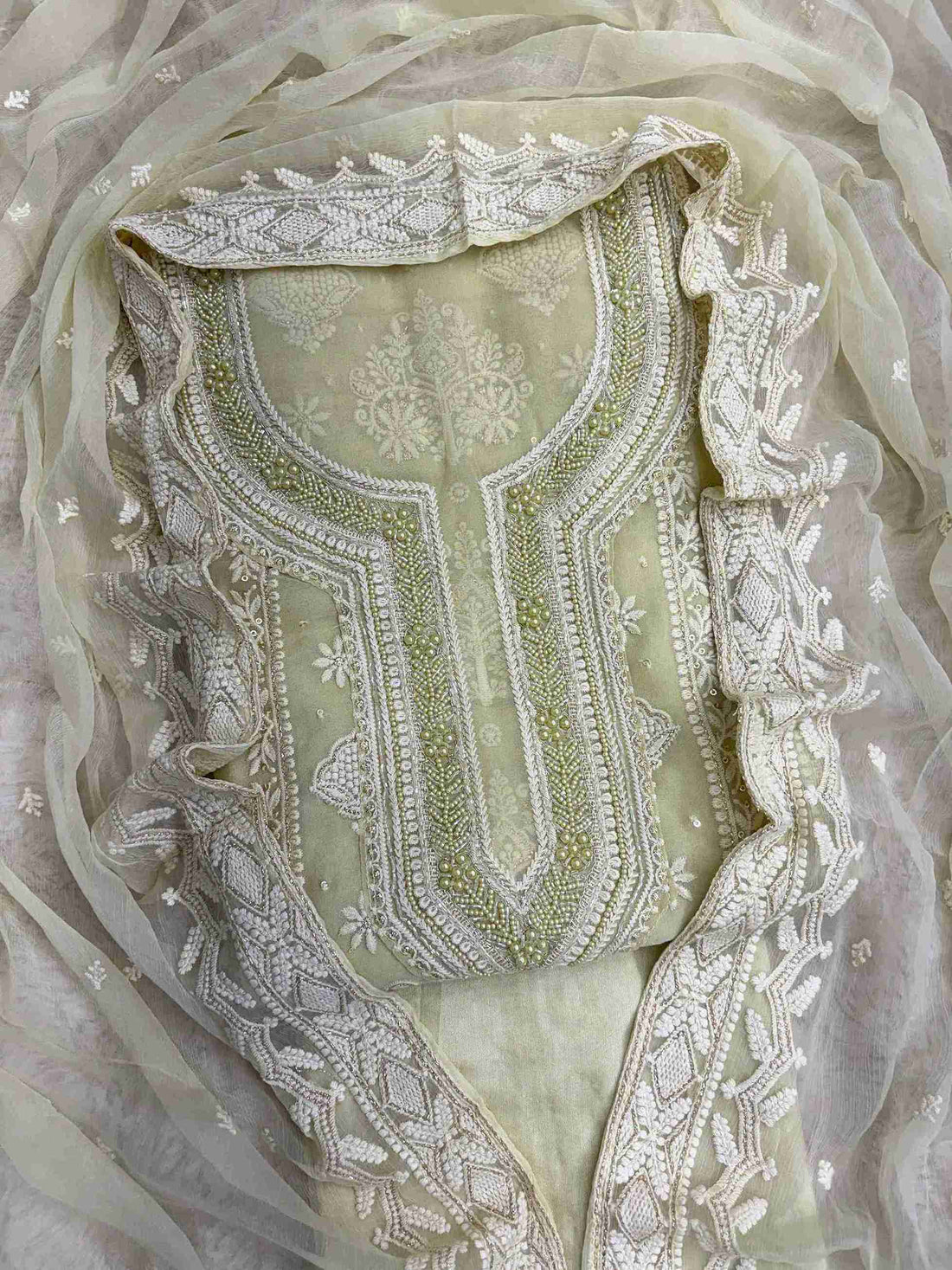 Mint green heavy chikankari wedding wear unstitched suit set front view