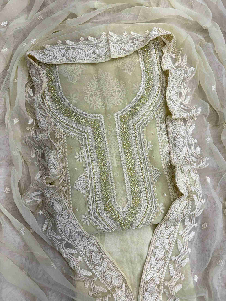 Mint green heavy chikankari wedding wear unstitched suit set front view
