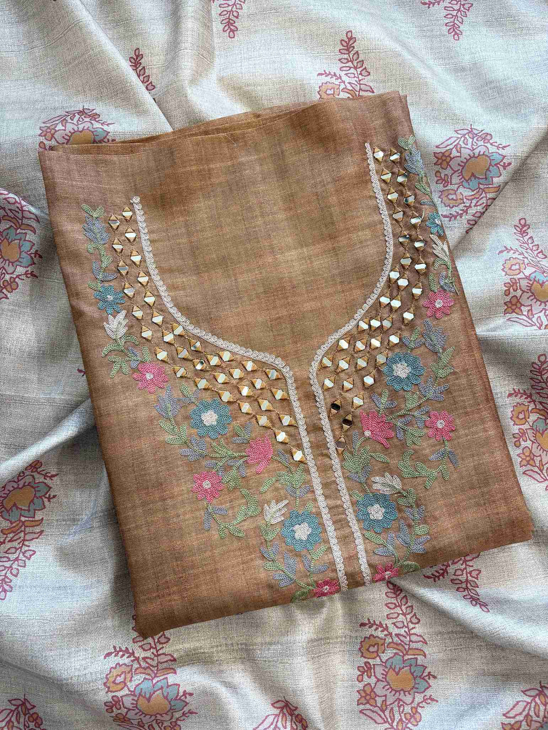 Close-up of heavy mirror and aari embroidery on tusser silk neckline