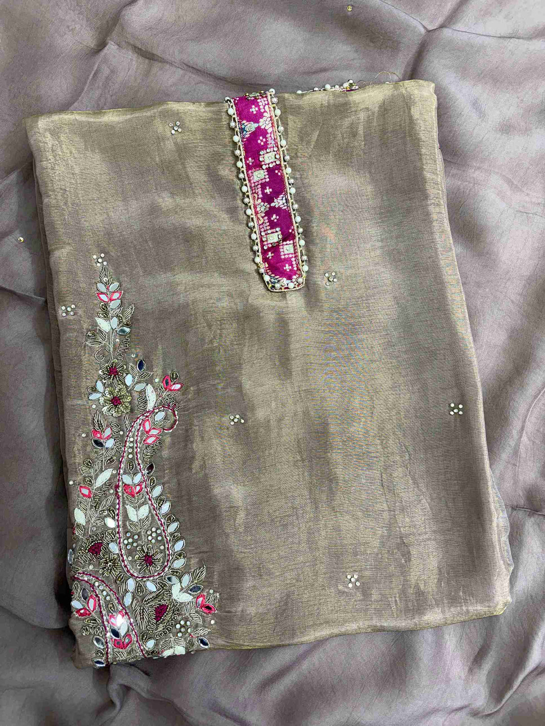 Striking magenta embroidered neckline patch with crotia lace outline on mocha brown organza shirt