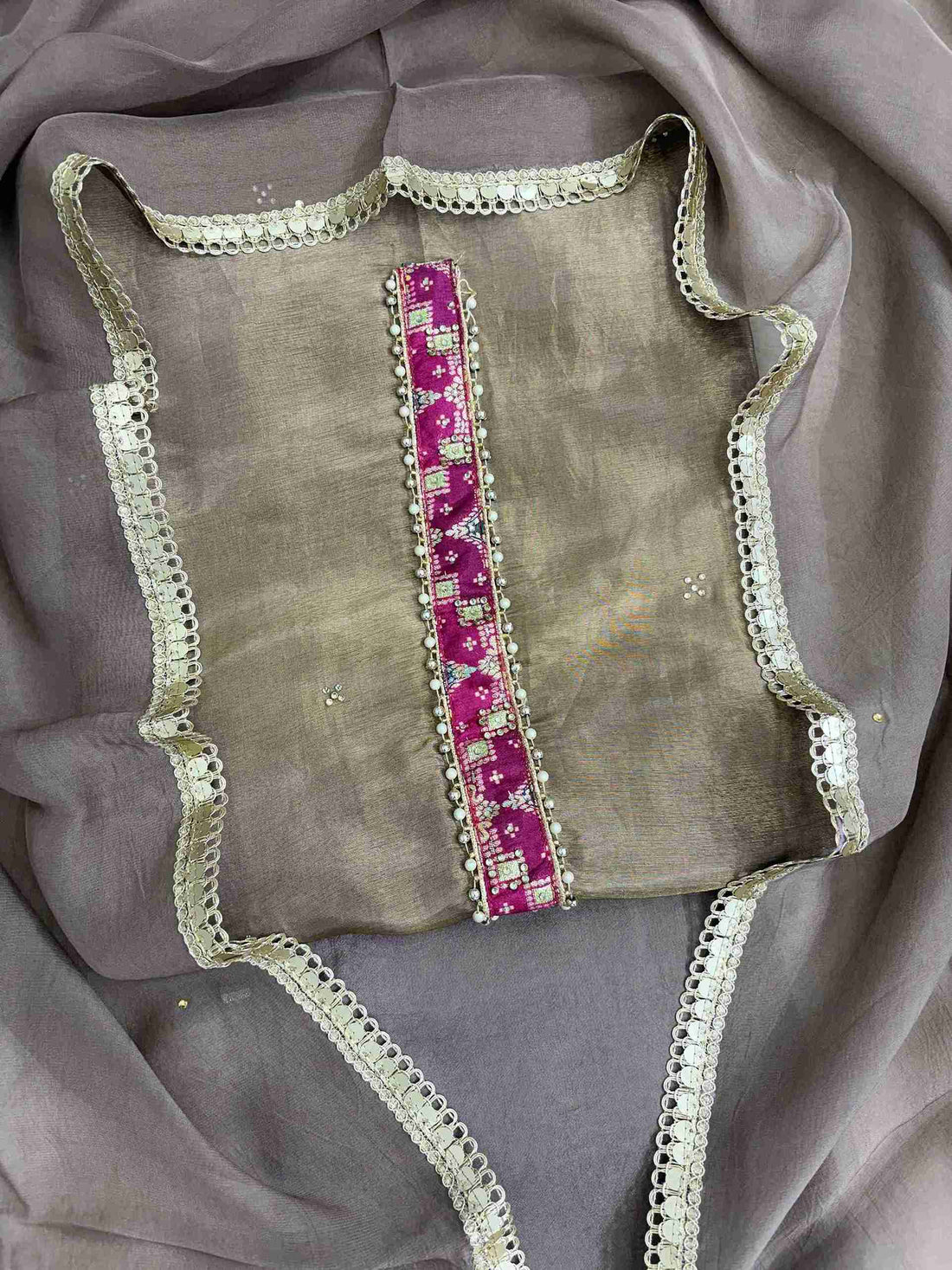 Mirror work, sequin accents, and thread embroidery detail on mocha brown organza shirt body