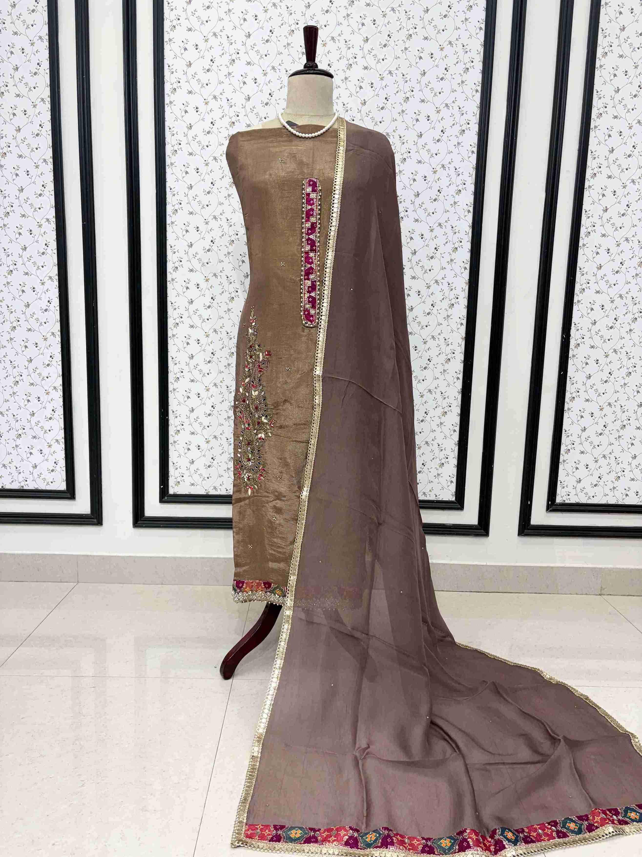 Mocha brown organza unstitched suit full front view with mirror lace bordered dupatta draped on mannequin