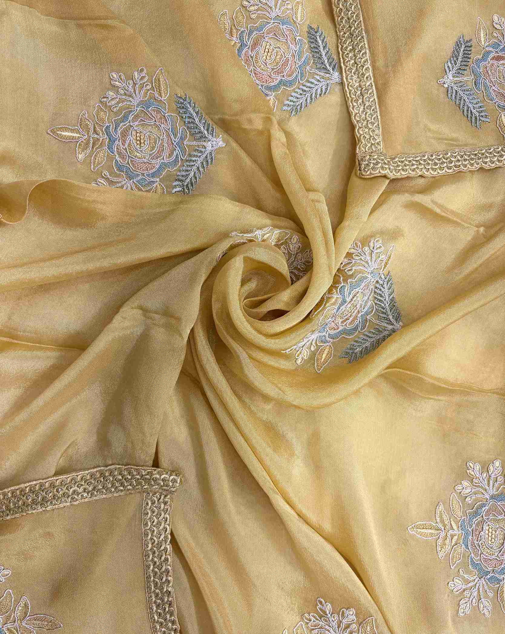 Lace-finished hemline detail on mustard yellow chiffon dupatta