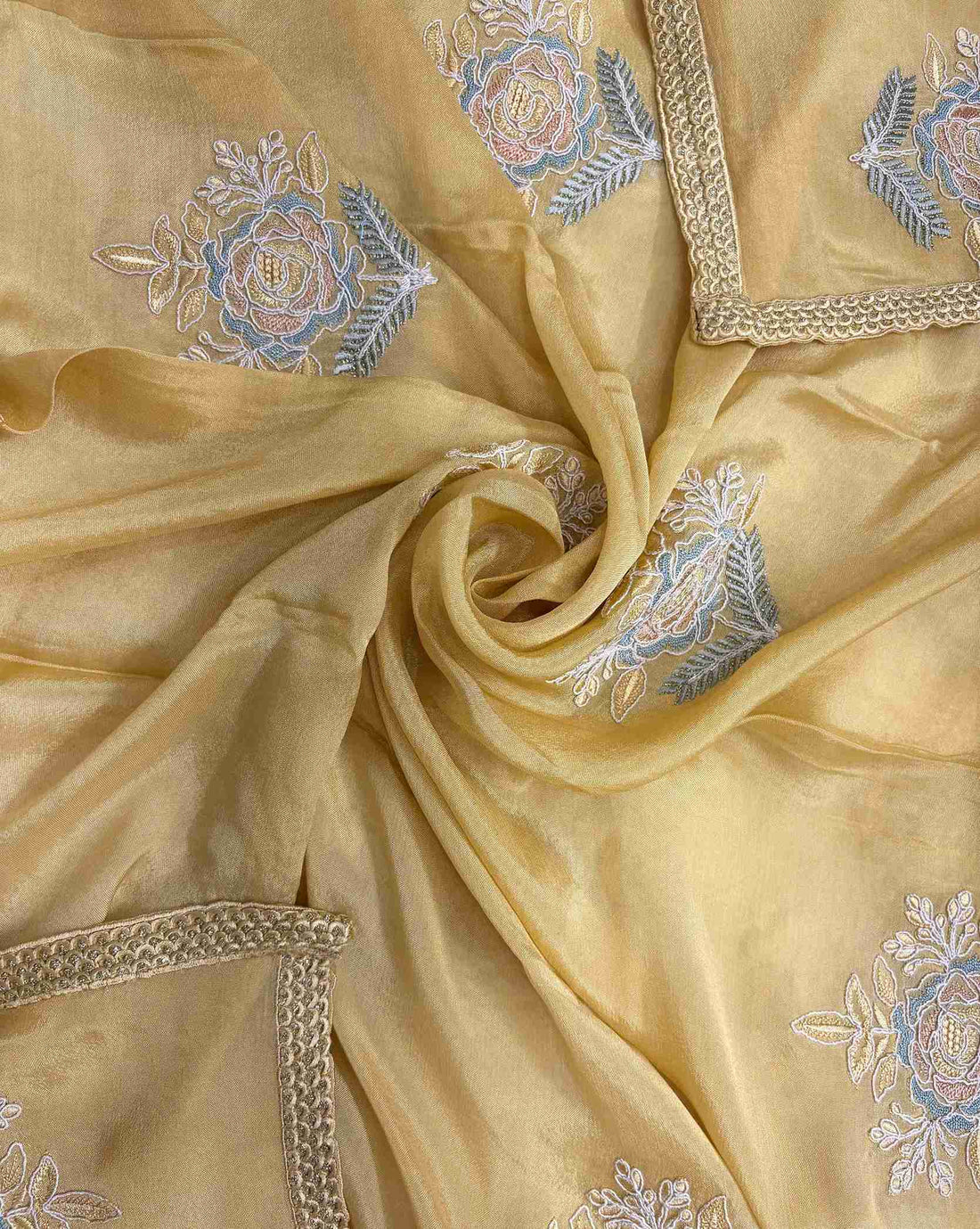 Lace-finished hemline detail on mustard yellow chiffon dupatta