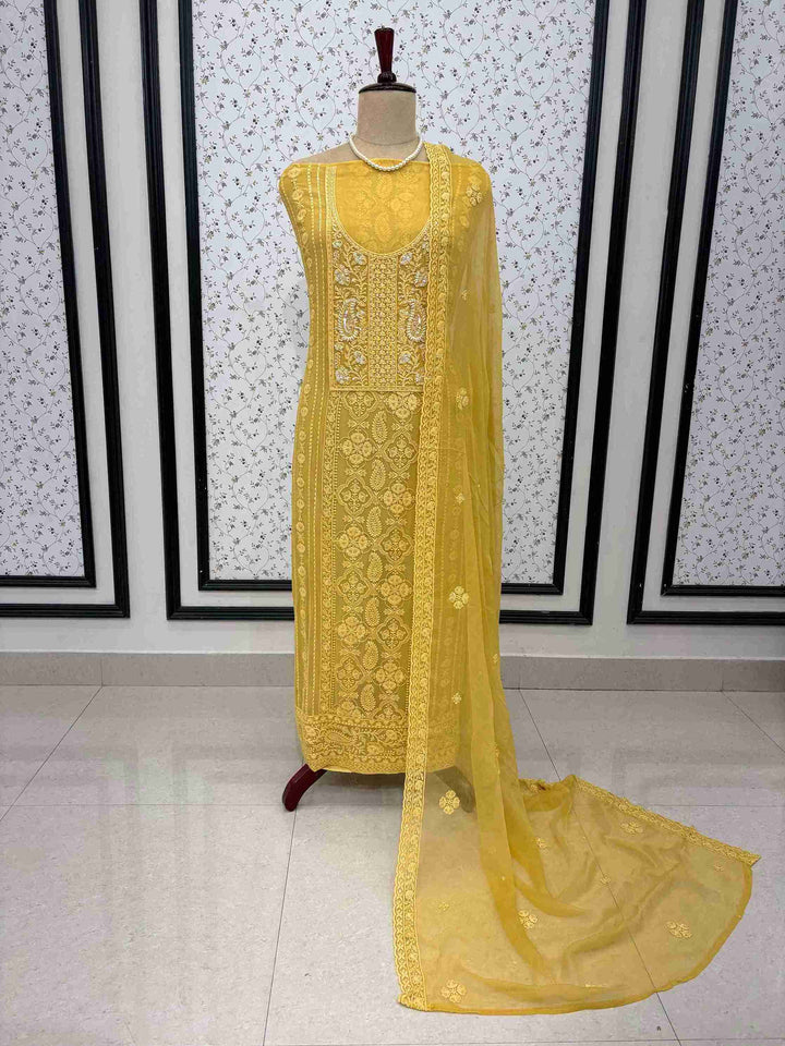 Complete mustard yellow chikankari unstitched suit with dupatta and bottom