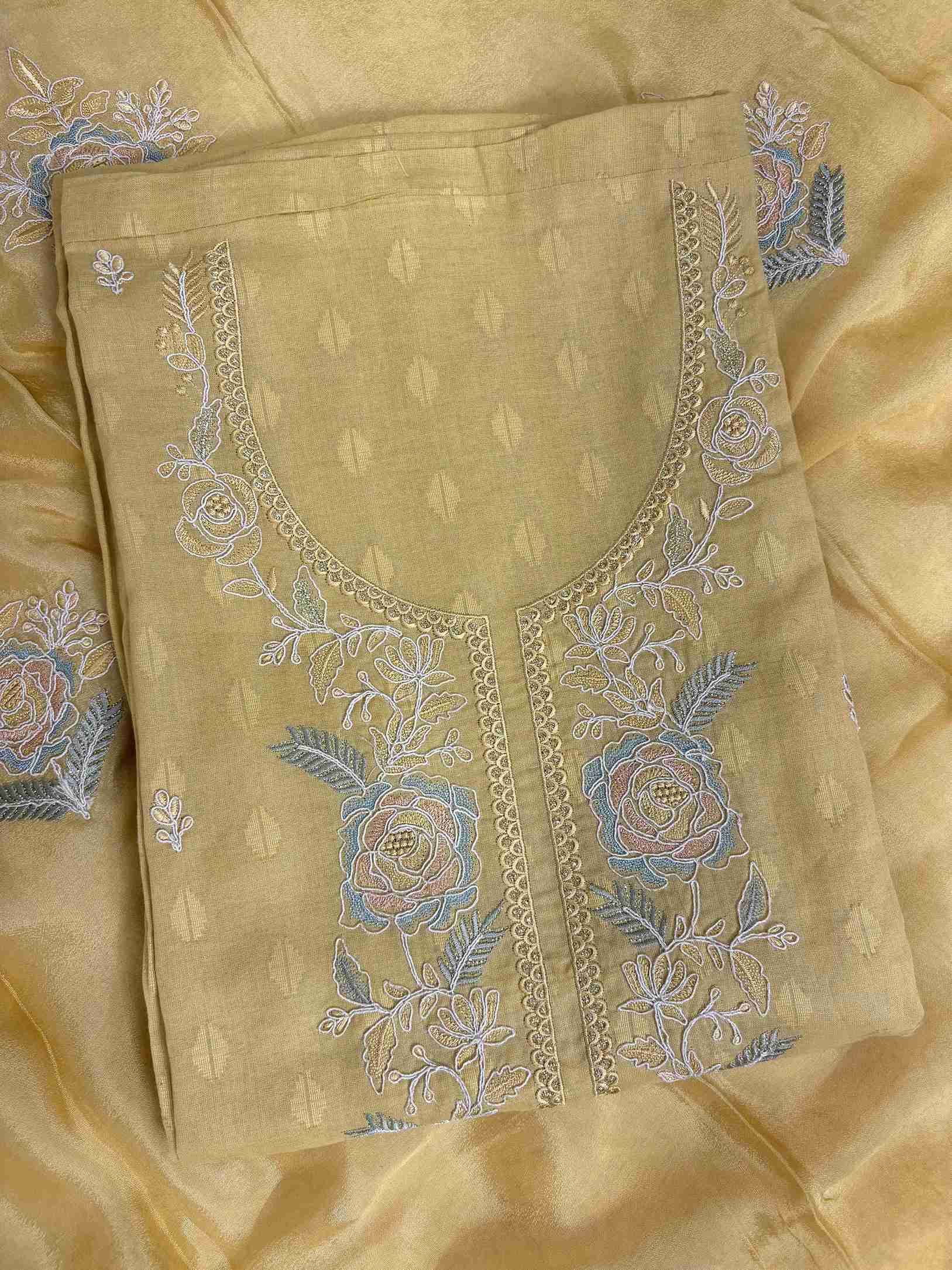 Floral embroidered booti detail on mustard yellow cotton unstitched suit