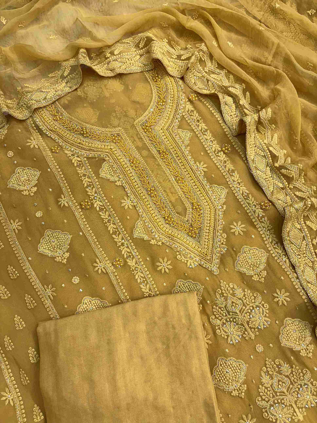 Mustard yellow party wear unstitched suit set with chiffon dupatta and cotton silk bottom
