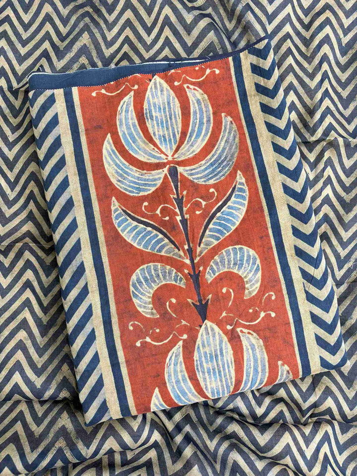 Large rust and blue floral inspired motifs on central front panel of navy blue mul cotton shirt