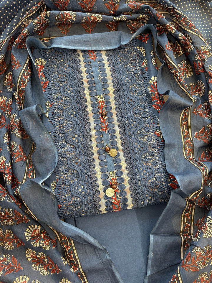 All-over block print floral booties in red, cream, and white tones on navy blue cotton shirt body