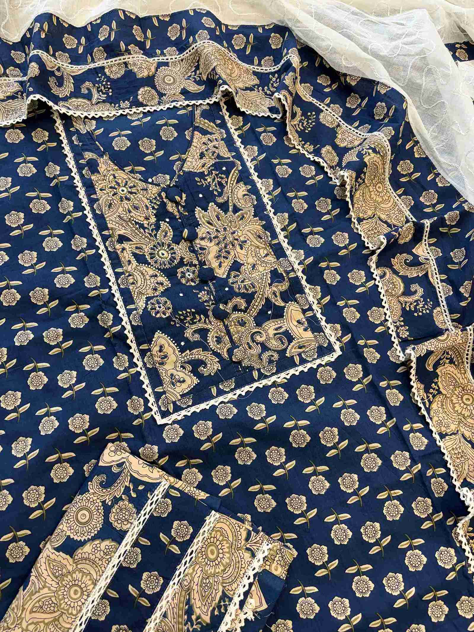Complete navy blue cotton unstitched suit flat lay set with golden print shirt, white dupatta, and matching navy blue bottom