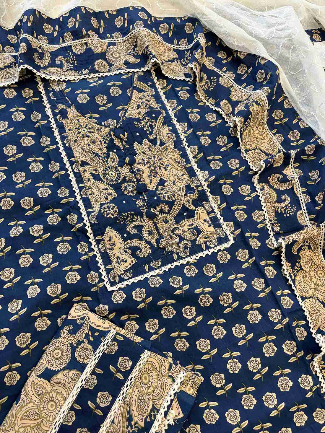 Complete navy blue cotton unstitched suit flat lay set with golden print shirt, white dupatta, and matching navy blue bottom